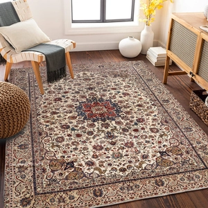 Detail of Persian style rug with central medallion pattern in a sunlit living room