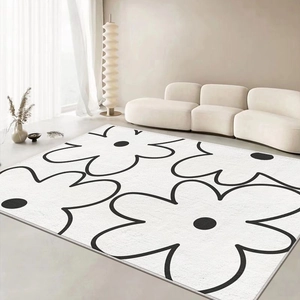 Modern minimalist black and white floral cashmere-like rug for a stylish living room