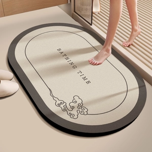 Detail of soft diatom mud bath mat with Bathing Time text and non-slip texture