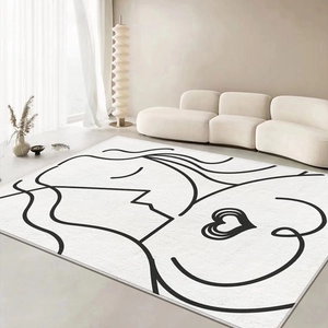 Detail of minimalist faux cashmere rug with black abstract line art and heart design