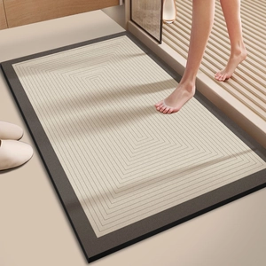 Close-up of minimalist diatom mud bath mat showing water absorption and geometric patterns