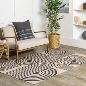 Detailed close-up of geometric pattern on beige modern rug over hardwood floor