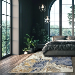 Detail of modern marble pattern rug in navy and gold for luxury living room