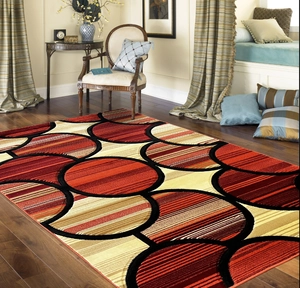 Close-up of modern abstract rug with overlapping circular geometric patterns and stripes