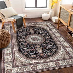 Detailed close-up of a Persian style rug with medallion pattern on wooden floor