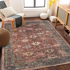 Overhead view of large Persian style area rug with vintage rusty red geometric patterns