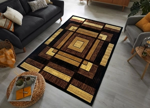 Detailed overhead view of modern geometric area rug with brown and gold cubist patterns