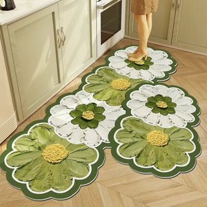 Floral kitchen floor mats featuring white daisy patterns on a dark green non-slip surface