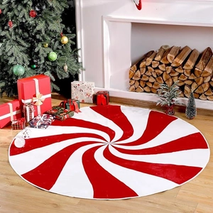 Detail of red and white spiral peppermint Christmas tree skirt in a cozy home setting