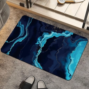 Detailed view of the marble pattern bath mat with blue fluid art and gold accents