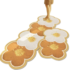 Floral shaped kitchen runner rug with plush texture in white and orange blossom pattern