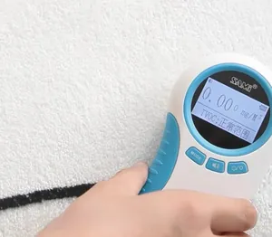 Macro shot of SAMI air quality tester showing real-time TVOC and formaldehyde levels
