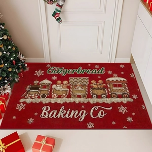 Detailed top view of red gingerbread train Christmas doormat on indoor flooring