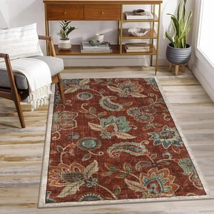 Retro terracotta rug with teal floral patterns on light wood floor in modern living room