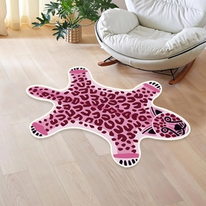Pink tiger shaped faux cashmere rug with red leopard spots on modern wood floor