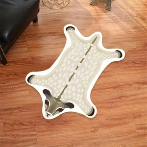 Detailed top view of a soft faux cashmere tiger-shaped rug on dark wood flooring