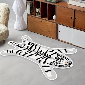Detailed view of a white tiger-shaped cashmere rug on a modern minimalist floor