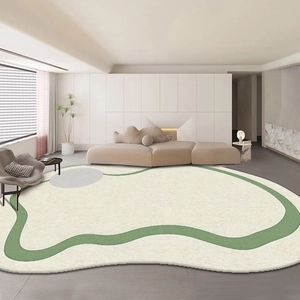 Irregular bean-shaped faux cashmere rug in cream white with green wavy edges and grey dots