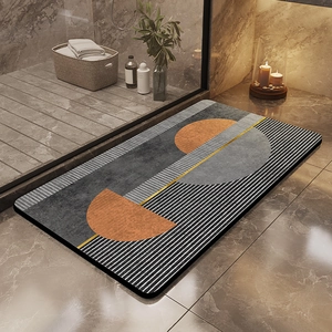 Detail of diatom mud bath mat with orange geometric patterns on marble floor