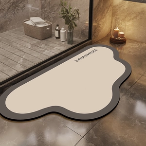 Cloud-shaped sunshine diatom mud bath mat with gray border on marble floor