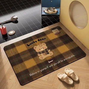 Absorbent diatomite bath mat featuring a cute cartoon lucky bear on brown plaid pattern