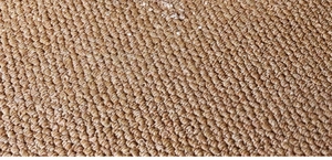 Macro shot of high-density sisal rug texture showing natural fiber weave details