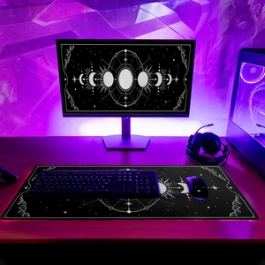Large gaming desk mat with lunar phase and celestial star design and stitched edges
