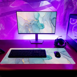 Detail of extra large RGB gaming mouse pad with blue marble design and LED lighting edges