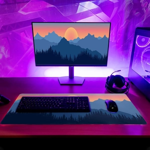 Detail view of large RGB gaming mouse pad with scenic mountain landscape and purple light