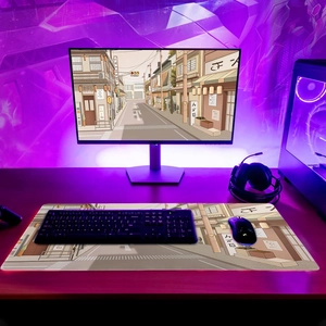 Detail of RGB gaming desk mat with Japanese street scene art and red LED light edges