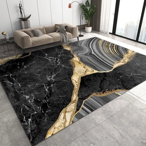 Détail d'un tapis en marbre luxueux avec motifs abstraits noir gris et or pour le salon