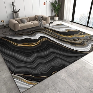 Vue détaillée d'un tapis moderne à motif marbre et veines dorées pour salon élégant