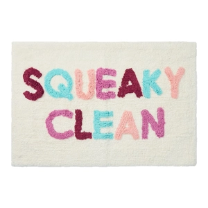Plush bathroom rug with Squeaky Clean lettering and colorful tufted fiber texture