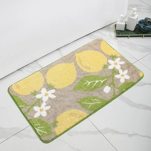 Detail of cute lemon bath mat with absorbent faux cashmere texture on white tile floor