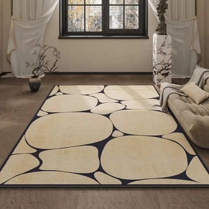 Tapis minimaliste aux motifs de galets beige sur fond bleu marine avec bordure noire cousue