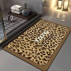 Detailed view of leopard print bath mat with YOUNG text in a modern bathroom setting