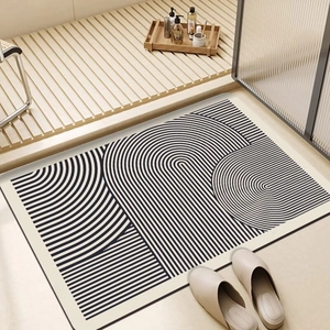 Japanese Wabi-sabi style diatom mud bath mat with black geometric lines on cream base