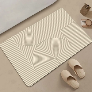 Detailed top view of a minimalist beige diatom mud mat with geometric line patterns