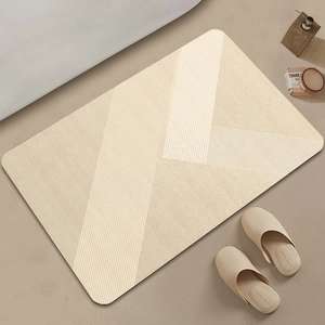 Macro view of beige diatomaceous earth bath mat with minimalist brown geometric stripes