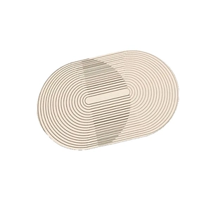 Oval diatomaceous earth bath mat with minimalist wabi-sabi concentric grooves