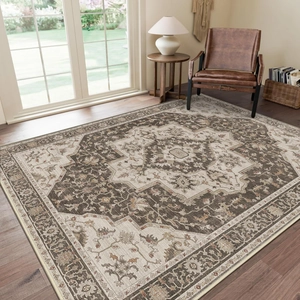 Detail of vintage Persian style faux cashmere rug with intricate patterns in brown and beige