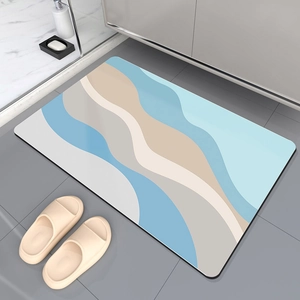 Absorbent diatomite bath mat with abstract blue wave design and anti-slip backing