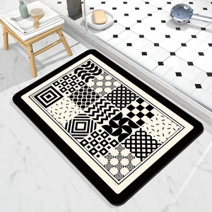 Detailed pattern of absorbent bath mat with black and white geometric checkerboard design