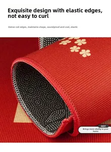 Détail du paillasson rouge à fleurs avec envers antidérapant et bordure cousue durable
