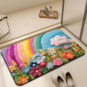 Detail showing high-density 3D floral pattern texture on an absorbent bathroom mat