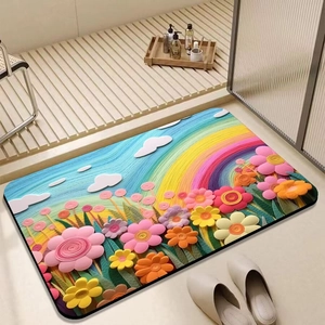 Detail of floral diatom mud bath mat with 3D paper art style flowers on wooden floor