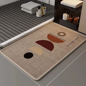 Detail of linen diatomite mat featuring modern geometric patterns and welcome home text