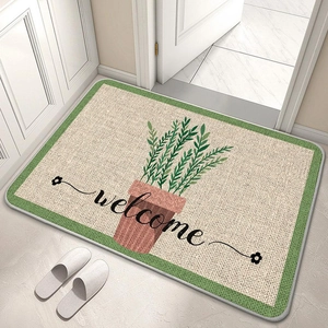 Detail of floral welcome mat with green border on marble floor with white slippers