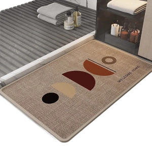 Linen diatom mud bath mat with geometric pattern and Welcome Home text in beige and brown