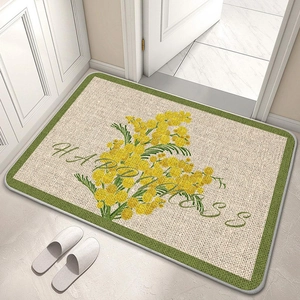 Detail view of floral diatomite bathroom mat with yellow mimosa and Happiness text